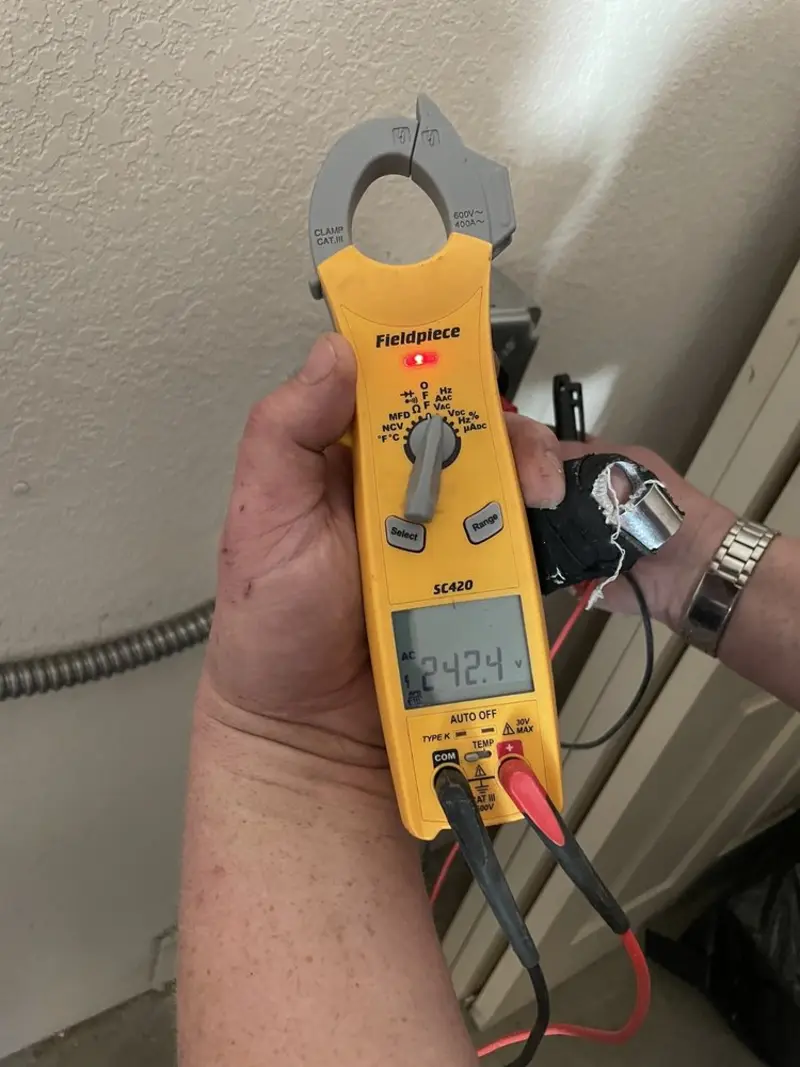 Voltage testing with clamp meter during Outlet Installation in Glencoe